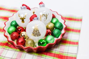 white glitter ornaments with a gold foil design