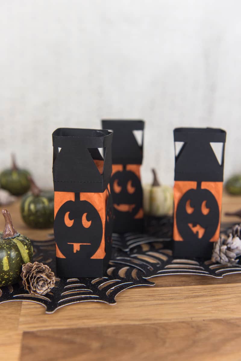 Paper Pumpkin Lanterns - I love lanterns but I hate spending money on them at the store so I decided to make my own mini Halloween paper lanterns instead. They're an easy DIY, cheap, and family friendly. And can be made with a Silhouette or Cricut machine!