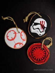 Star Wars Ornaments - Make your own rustic Star Wars Ornaments with wood slices, DecoArt paint, and your Silhouette machine! This simple + quick DIY is perfect for the Star Wars fans in your life!