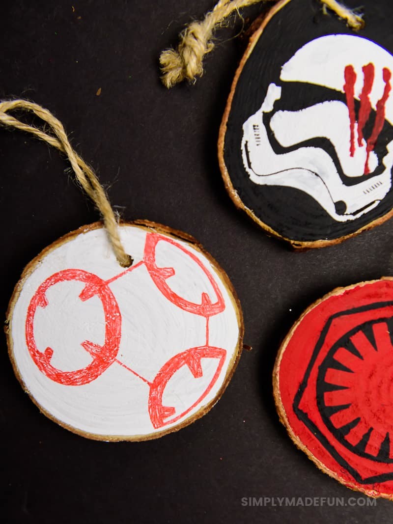 Star Wars Ornaments - Make your own rustic Star Wars Ornaments with wood slices, DecoArt paint, and your Silhouette machine! This simple + quick DIY is perfect for the Star Wars fans in your life!