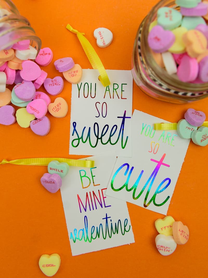 Deco Foil Valentine's Day Tags - I love the look of foil gift tags and never realized how easy it was to do at home! I used my MINC machine and deco foil from Expressions Vinyl to create these candy heart inspired valentines day gift tags!