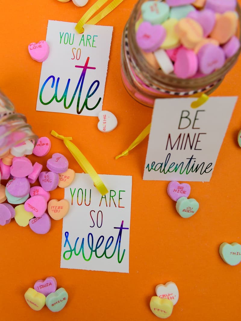Deco Foil Valentine's Day Tags - I love the look of foil gift tags and never realized how easy it was to do at home! I used my MINC machine and deco foil from Expressions Vinyl to create these candy heart inspired valentines day gift tags!