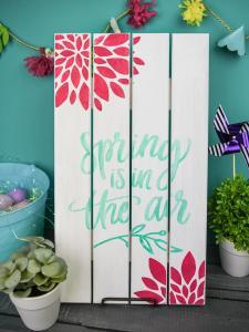 Painted Wooden Spring Sign - Dress up your front porch or your mantle this spring with a bright and colorful wooden sign! Use your Silhouette Cameo to cut out a stencil and pick your favorite paint colors to make this sign your own. It's fun, easy, and you can do it in 20 minutes (or less!).