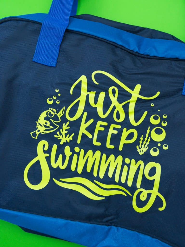 Just keep swimming Finding Nemo svg file on a polyester swim bag.