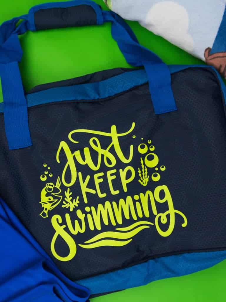 Just keep swimming Finding Nemo svg file on a polyester swim bag.