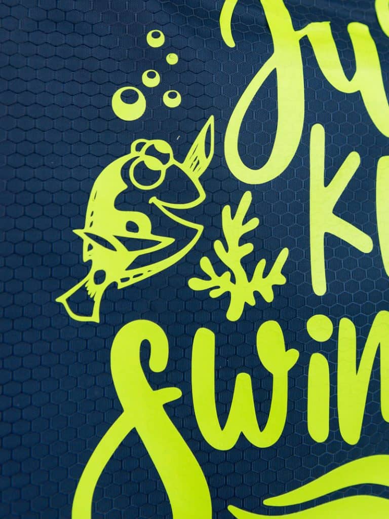 Just keep swimming Finding Nemo svg file on a polyester swim bag.