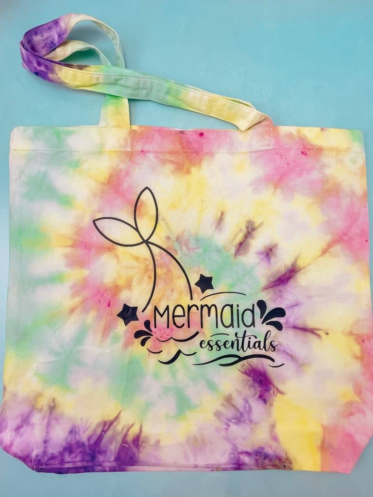 Mermaid Essentials SVG on a tie dye tote bag