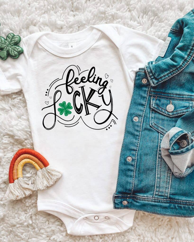 Feeling Lucky svg design on a baby onesie for St. Patrick's Day